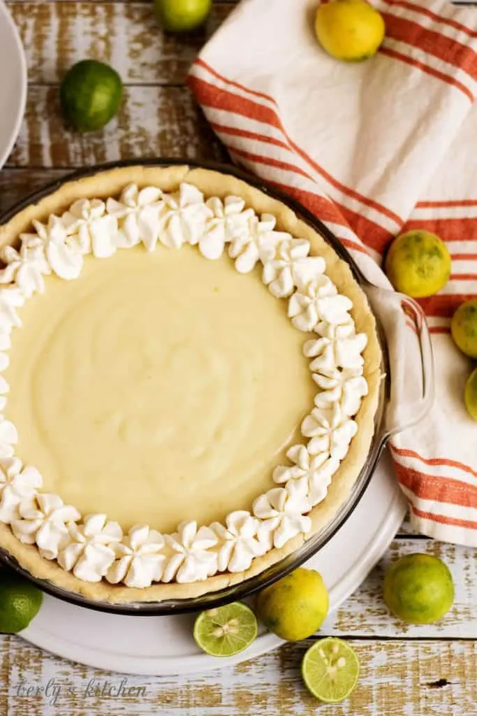 A homemade silky smooth key lime pie that's creamy, sweet, and tangy and is prepared with authentic key lime juice. It's the perfect for pie spring!