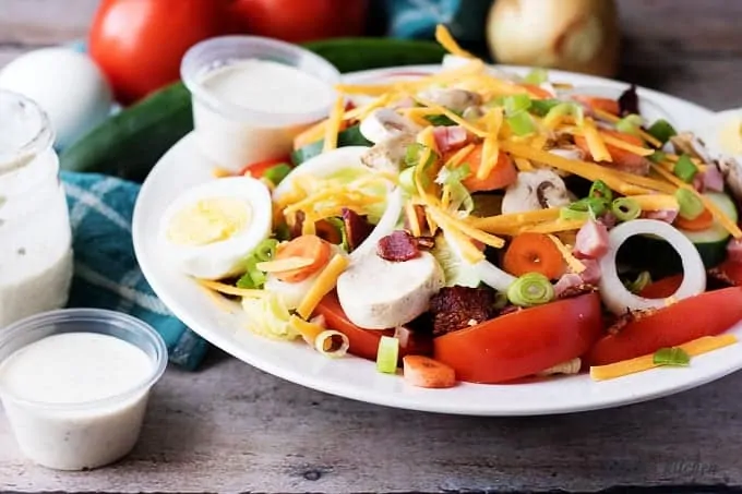 Diner chef salad with a side of ranch dressing.