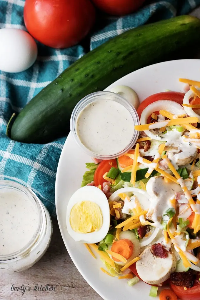 Salad covered with ranch dressing.