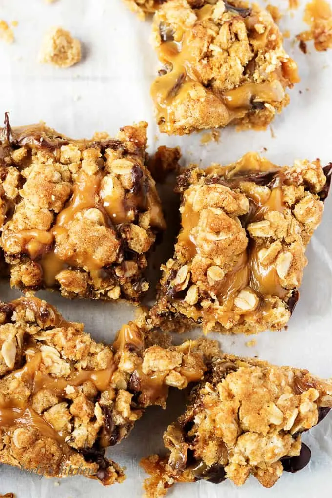 Ooey, gooey, and dripping with caramel, chocolate oat carmelita bars are the way to satisfy any sweet tooth.  who can resist a layer of melted caramel and chocolate sandwiched between a shortbread crust and oatmeal topping?