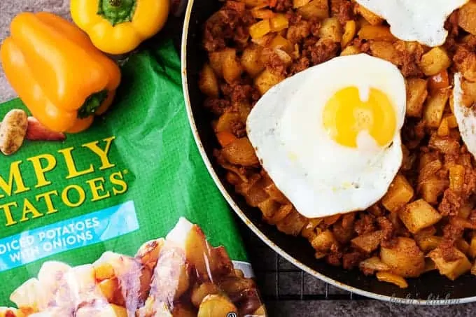 Choziro hash topped with eggs in a skillet.