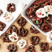 Top-down view of the chocolate covered pretzels recipe , white and dark chocolate dipped pretzels with sprinkles.