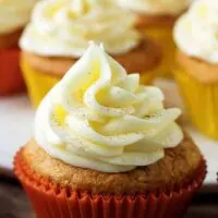 A side-view of the finished eggnog cupcakes, with buttercream frosting ready for serving.