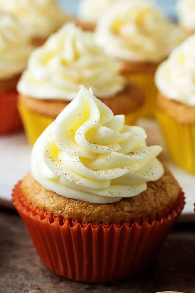 A side-view of the finished eggnog cupcakes, with buttercream frosting ready for serving.