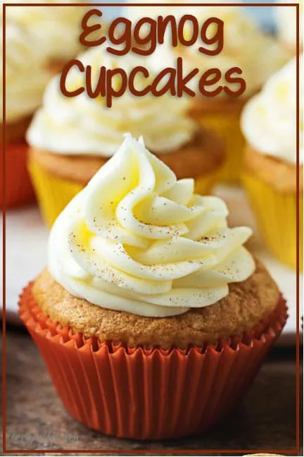 Eggnog cupcakes in an orange cupcake liner.