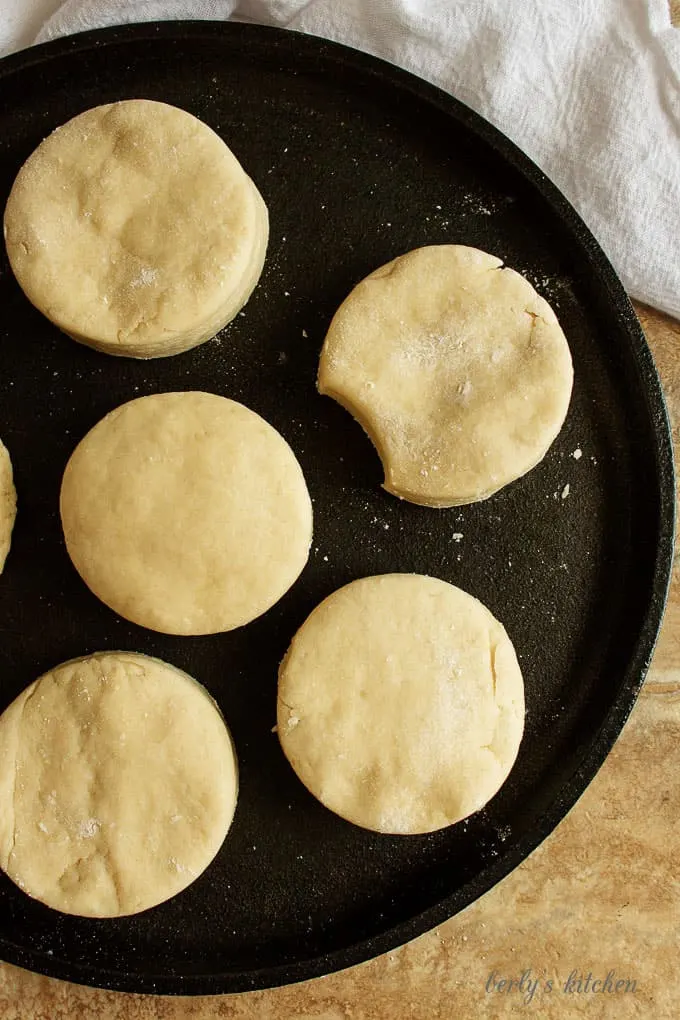 Ariel view of uncooked homemade buttermilk biscuit dough on cast iron.