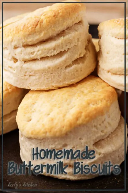 Homemade biscuits stacked on a plate.