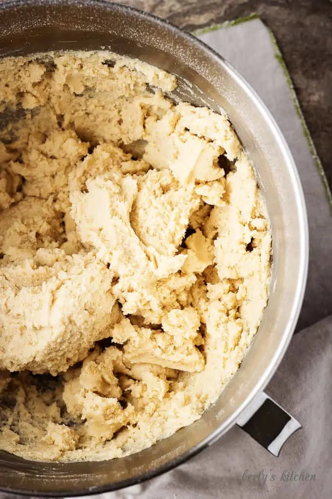 Top-down view of the soft sugar cookie dough in a mixing bowl.