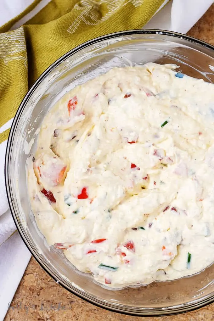 Another aerial shot of the dips mixed in a glass mixing bowl.