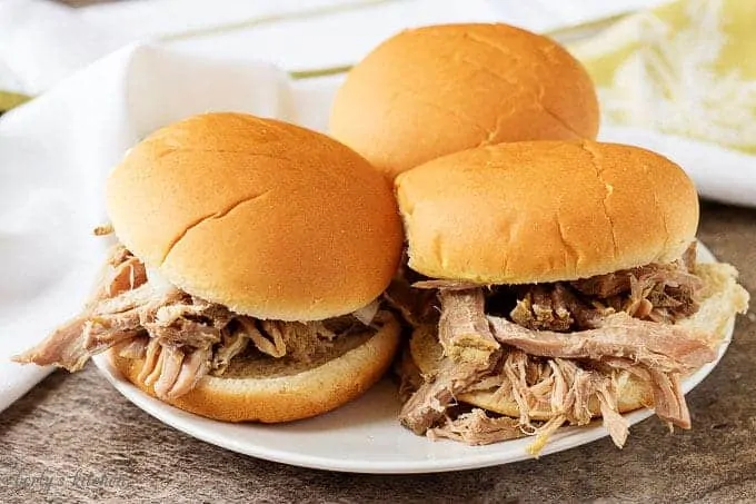 Pork pot roast sandwich on a white plate