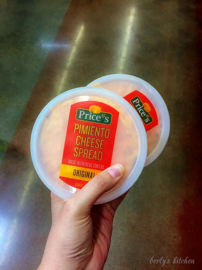 A close-up photo of the pimento cheese spread showing the package branding.