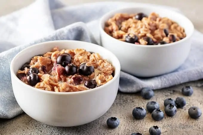 The finished blueberry oatmeal topped with even more blueberries and drizzled with heavy cream.