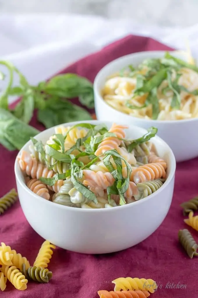 A final photo of the finished lemon cream sauce mixed with cooked pasta and garnished with fresh basil.