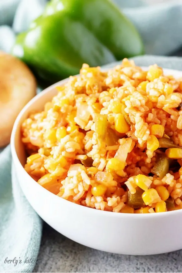 A large photo of the finished mexican rice in a white bowl.