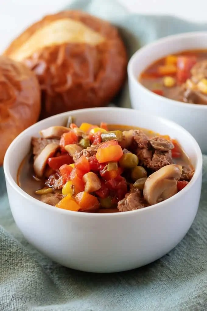 A close-up view of the finished vegetable beef soup in white bowl.