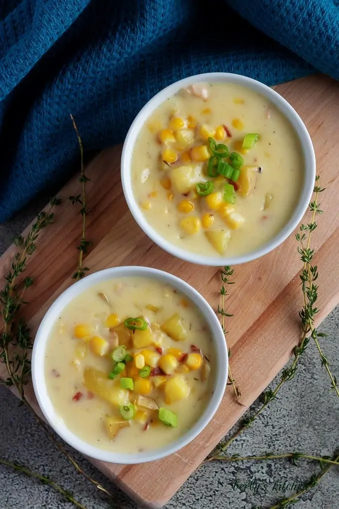 A top-down shot of instant pot corn chowder with bacon, topped with diced green onions.