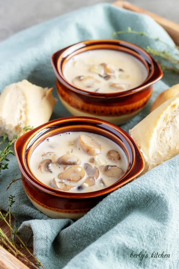 The soup has been finished and placed in bowls to be served with crusty french bread.