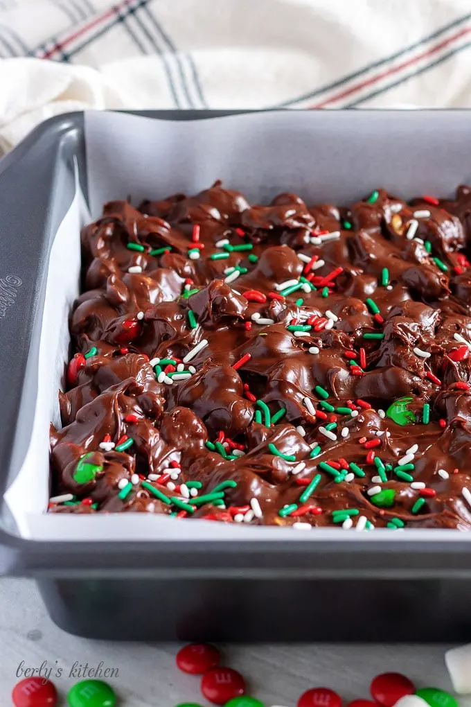 The fudge is setting in a lined baking sheet to cool.