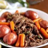 A final photo of the roast on a white platter for serving.