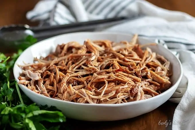 A small serving dish filled with the instant pot pulled pork.