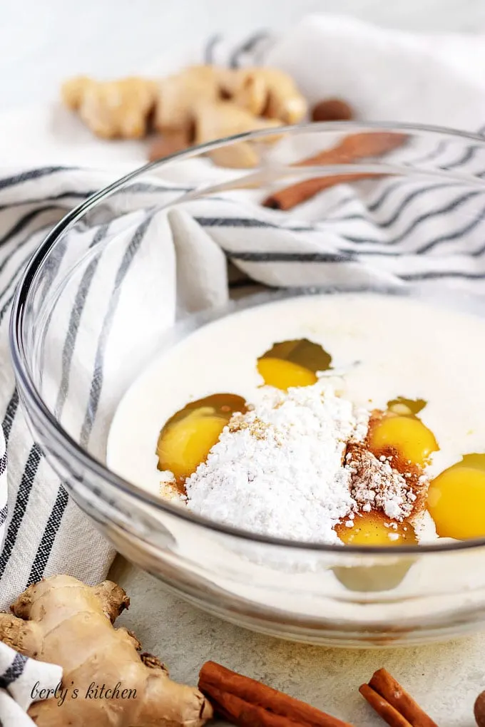 Ingredients for cinnamon french toast in a glass bowl.