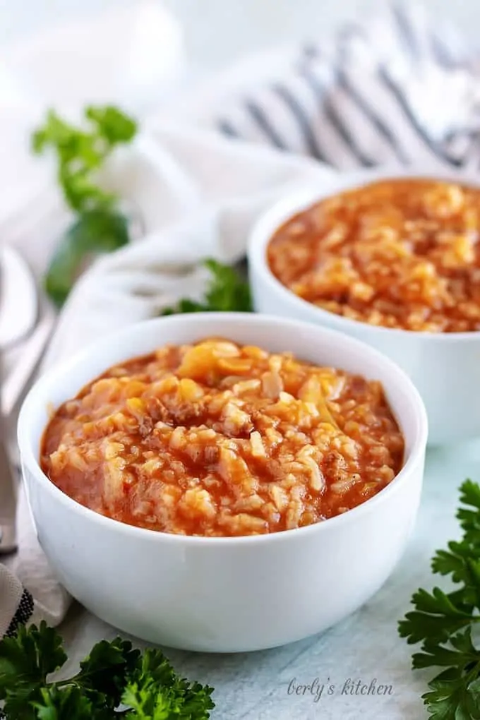 Instant pot unstuffed cabbage rolls in white dishes.