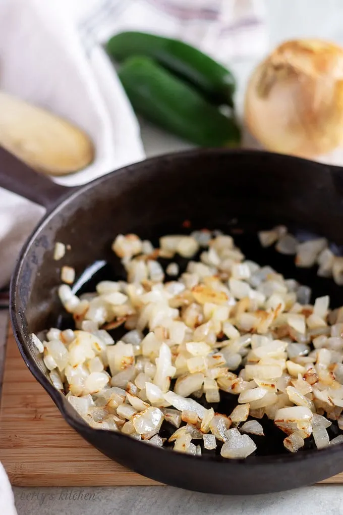 Another photo of the cast iron skillet with saute'd, diced, white onions.