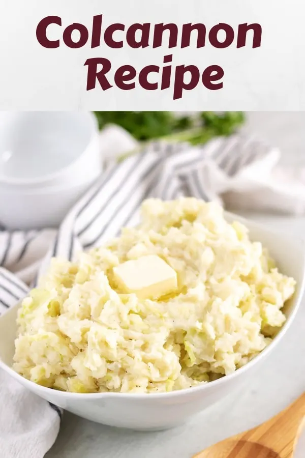 The finished colcannon recipe, served in a bowl, topped with butter.