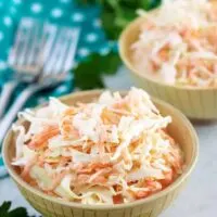 A large photo of the finished creamy coleslaw served in two bowls.