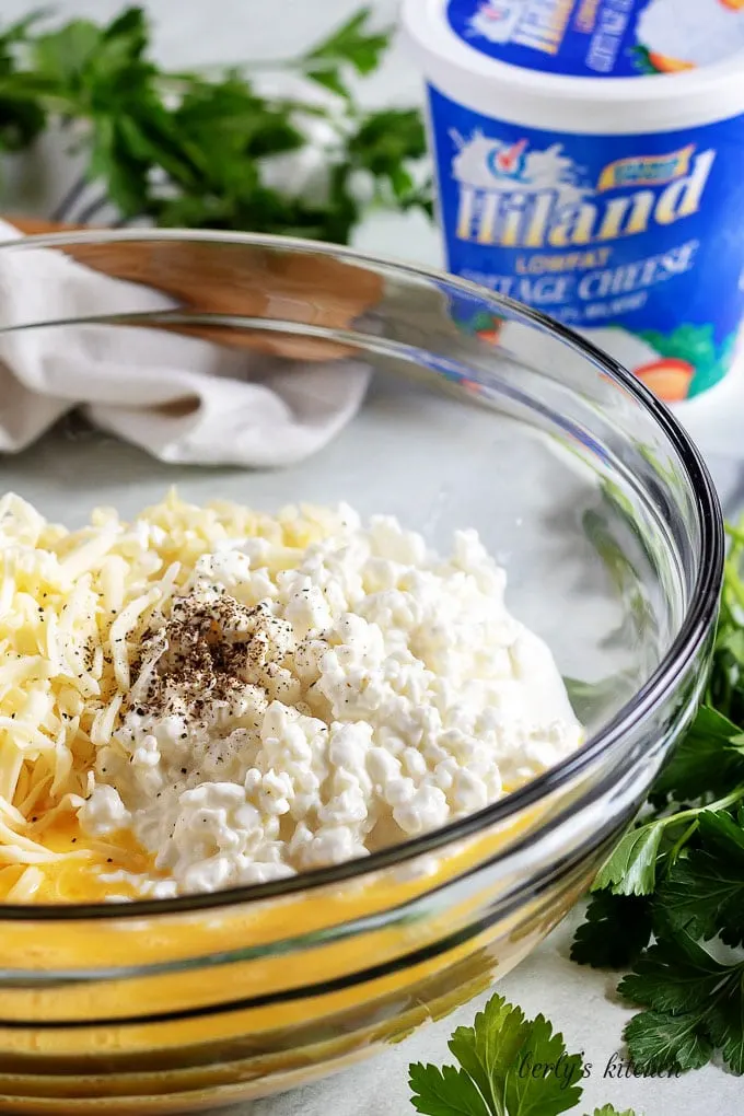 The filling ingredients, added to a glass mixing bowl to be combined.