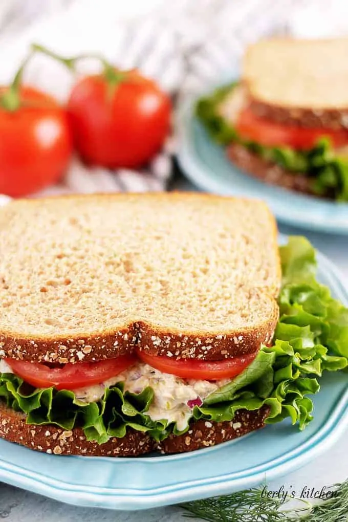 The finished sandwich, on whole wheat bread, with lettuce and tomato.