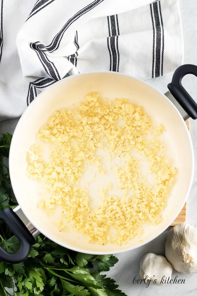 Another aerial view of the pan with cheddar cheese being added.