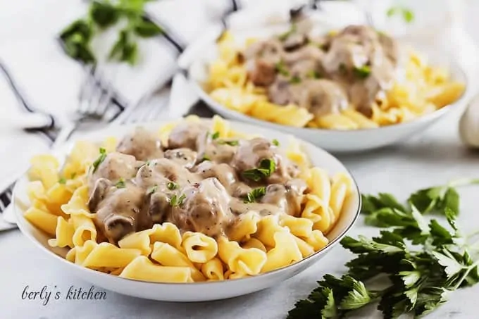 A pasta plate with the swedish meatballs served over pasta noodles.