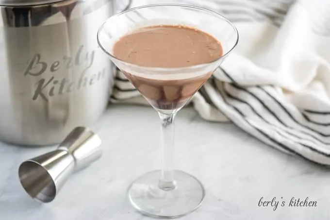 The double chocolate martini in a martini glass with a chocolate drizzle.