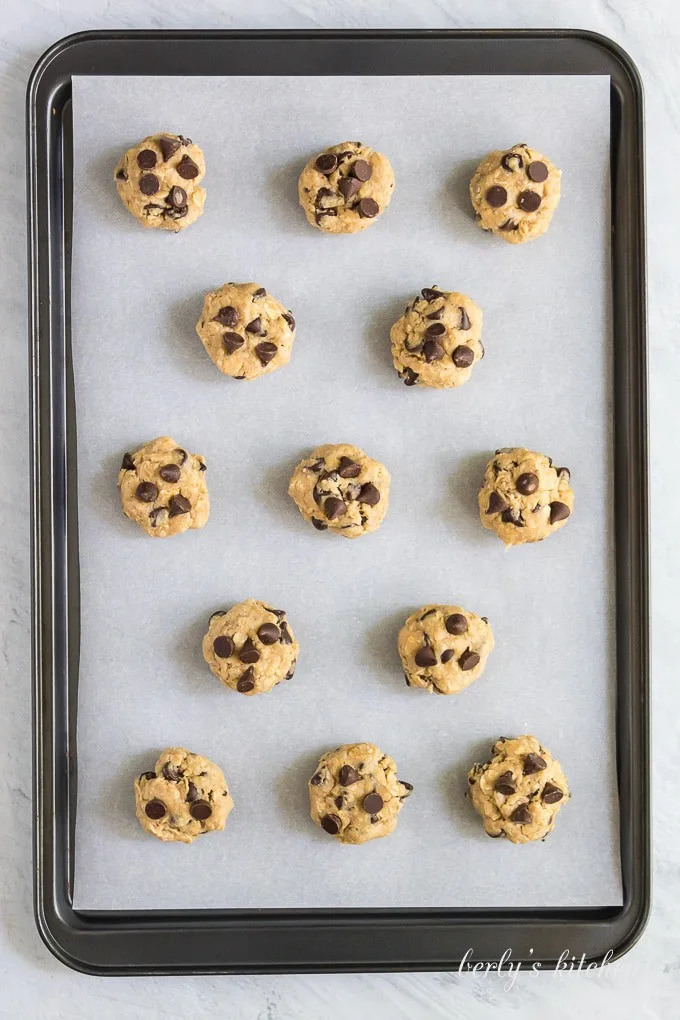 Dough has been formed into balls and placed on a cookie sheet.