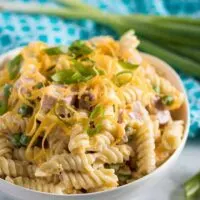 Another photo of the ham and cheese pasta in a white bowl.