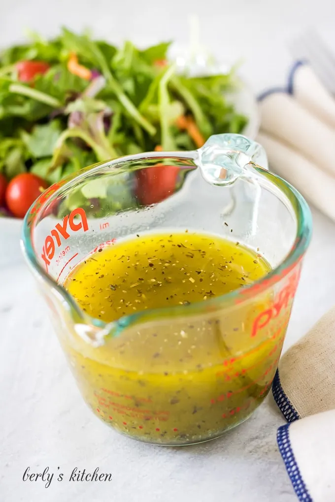 Everything in the cup has been combined to create the italian dressing.