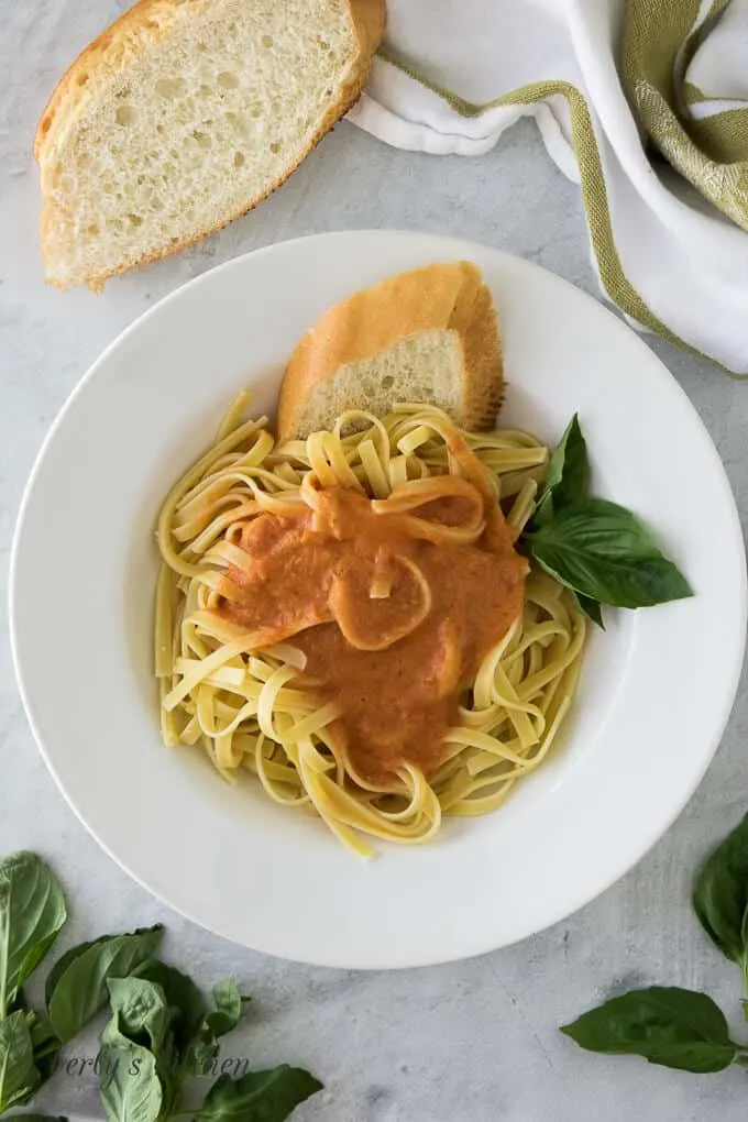 An aerial view of the bowl of pasta garnished with fresh basil.