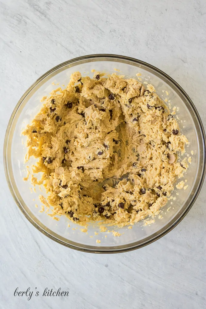 Caramel and chocolate chips have been stirred into the dough.