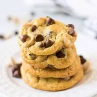 A stack of the caramel chocolate chip cookies on a plate.