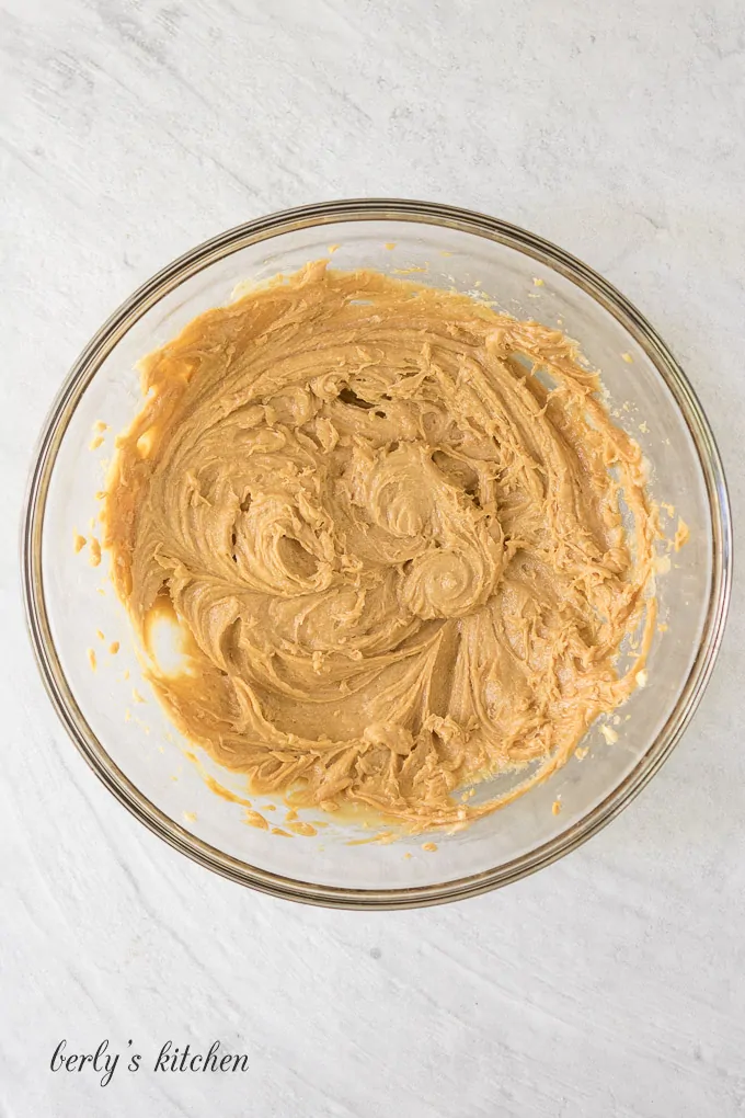 Peanut butter, egg, and vanilla added to the butter mixture.