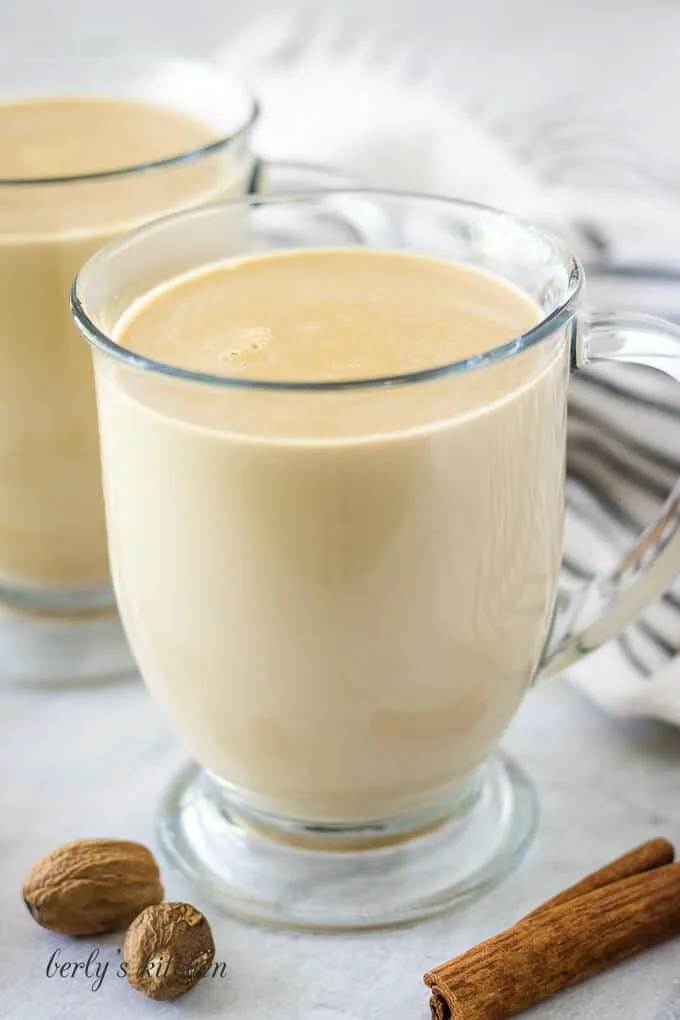 The finished coffee drink served in a clear, glass mug.