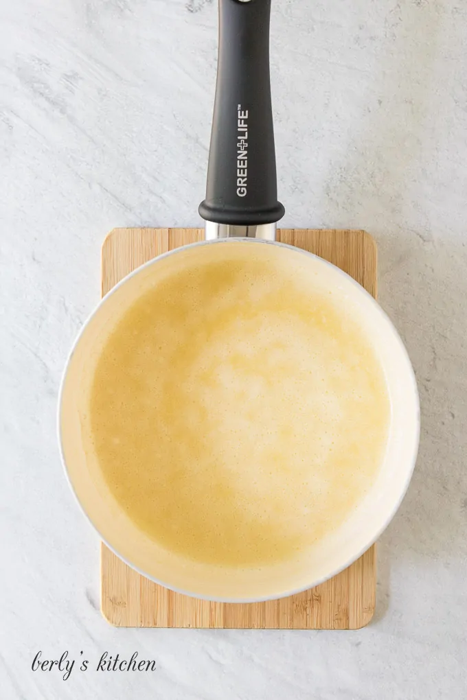 The flour and butter cooking in a large saute pan.