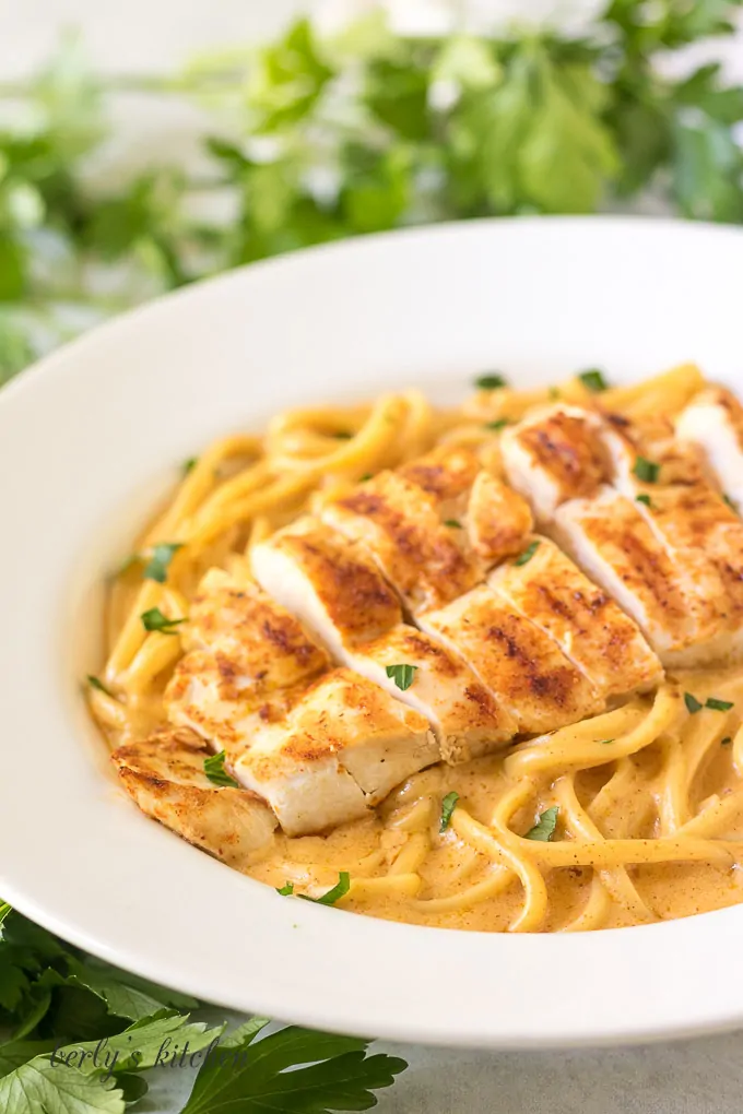 A close up view of the spicy chicken pasta in a large bowl.