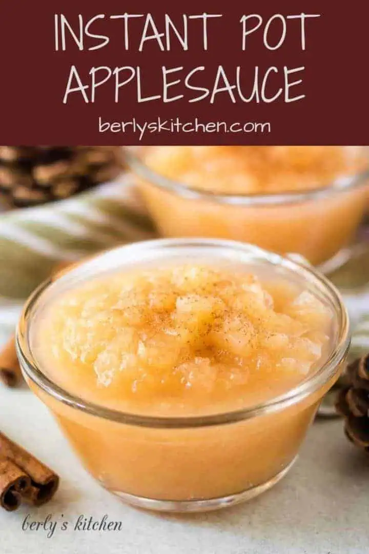 Two bowls of instant pot applesauce garnished with ground cinnamon.