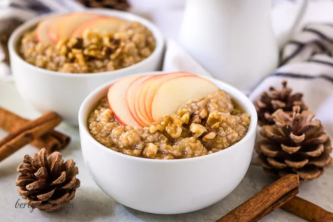 Two bowls of instant pot steel cut oats with apples.