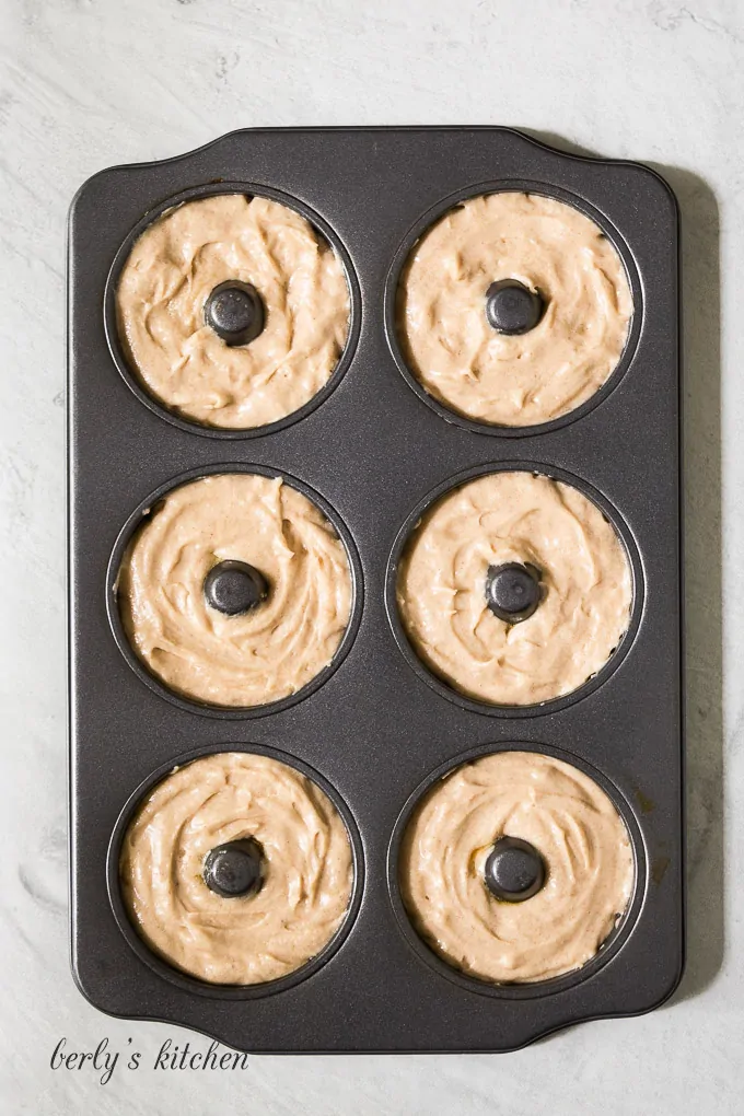 The batter has been transferred to a cake donut pan.