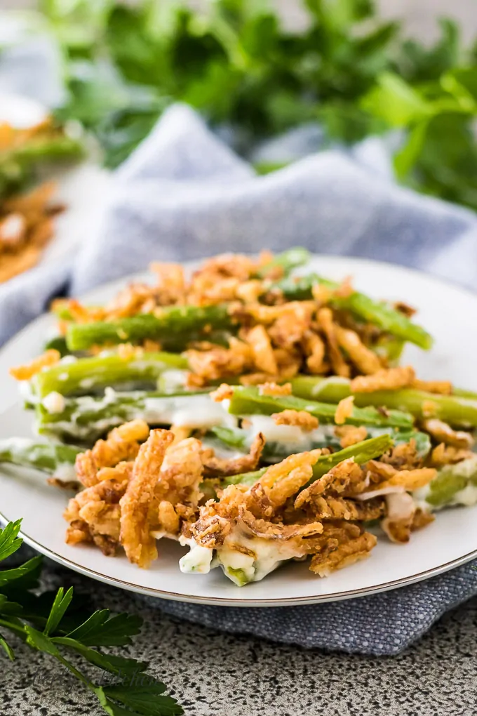 The finished green bean casserole served on a small saucer.