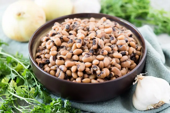 A decorative bowl filled with instant pot black eyed peas.