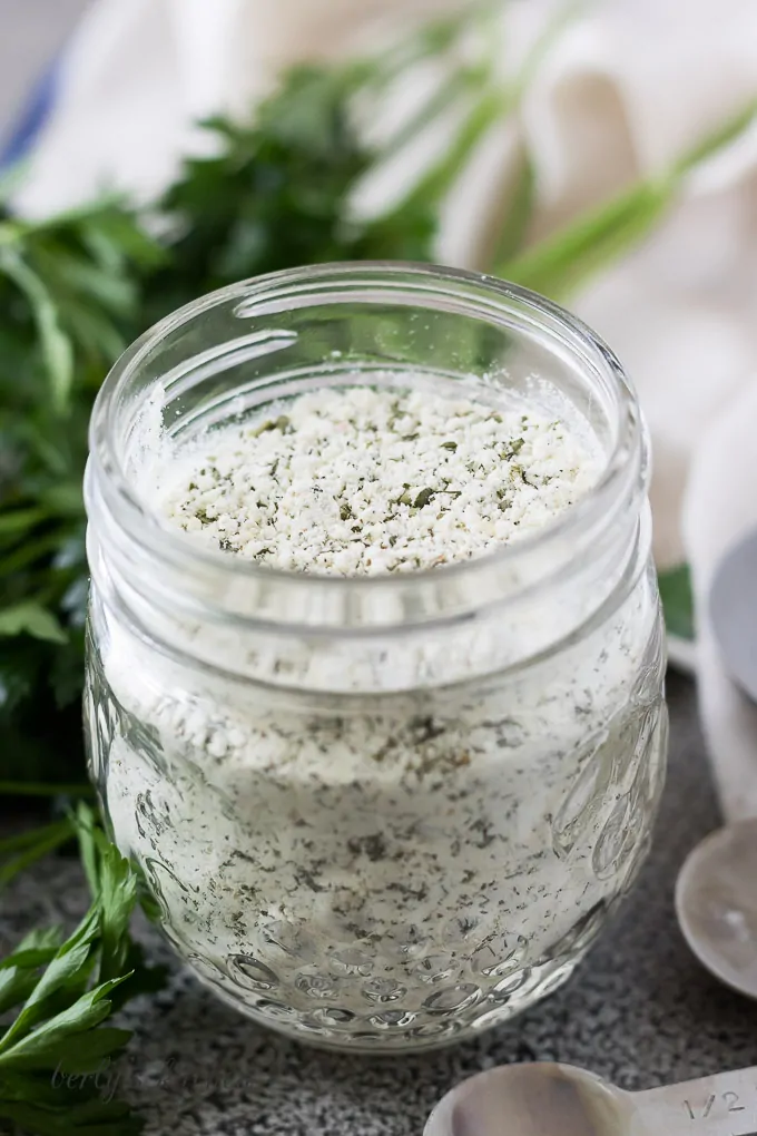 A small mason jar filled with homemade ranch dry mix.